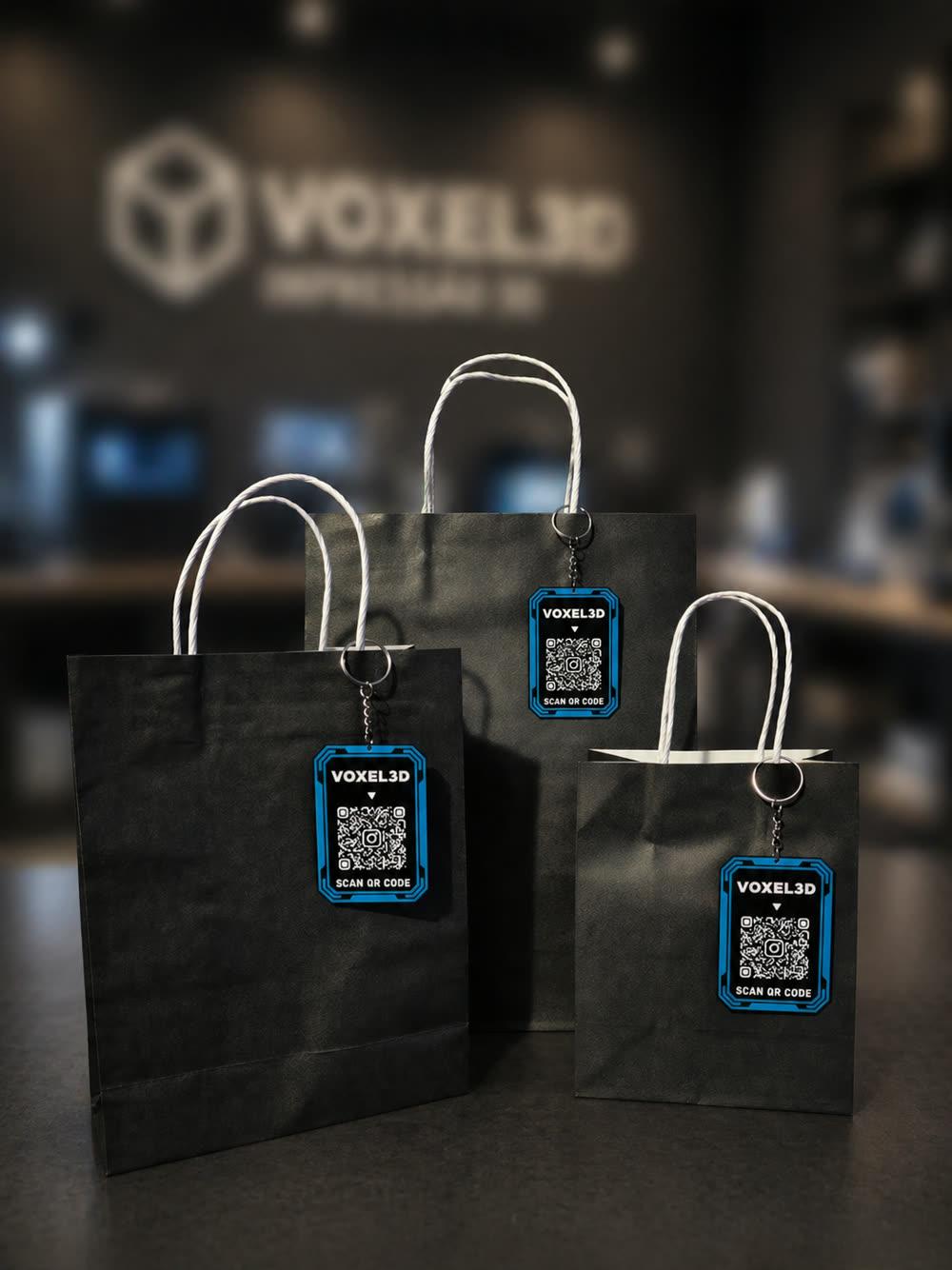Voxel3D branded packaging with a custom QR-code keychain